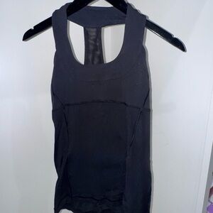 Lululemon Black Racerback with built in bra. Size unknown- see description